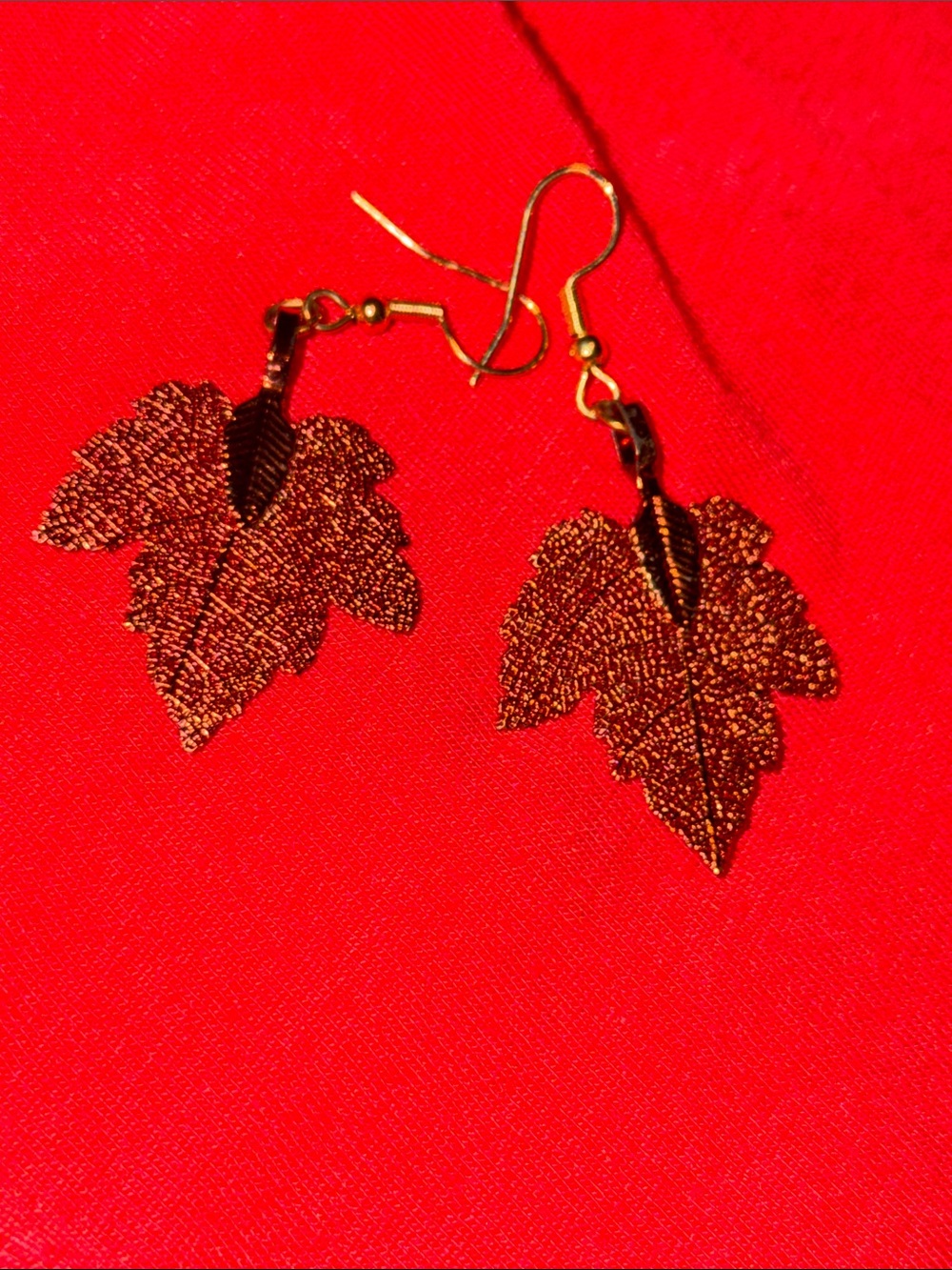 Copper-colored lightweight maple leaf earrings on goldtone fish hooks
